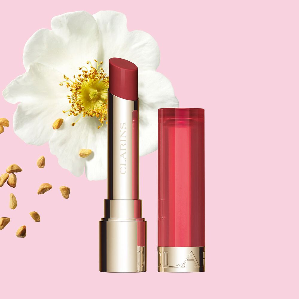 Clarins Nourishing Lip Oil Balm giving a subtle  bright red finish